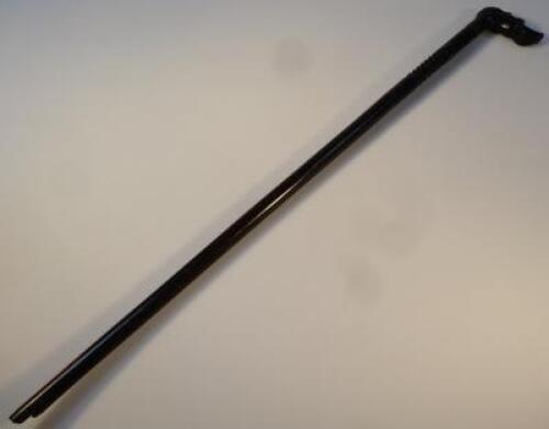 A heavily carved ebonised walking stick