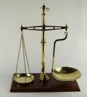 A pair of brass apothecary scales