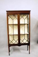 An Edwardian mahogany inlaid glazed display cabinet