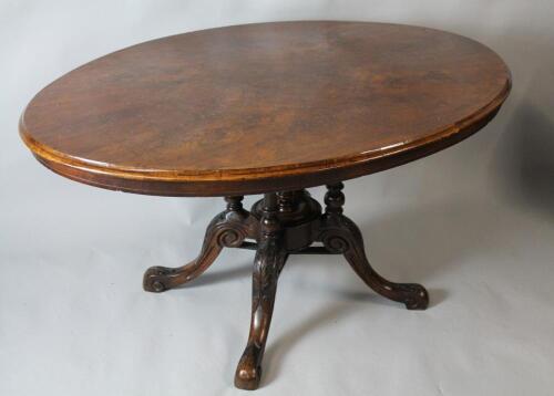 A Victorian walnut tilt top loo table