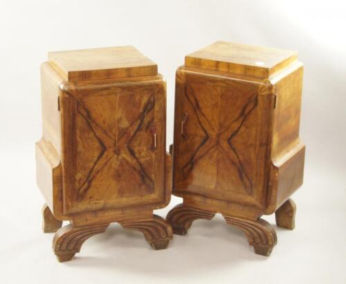 A pair of Art Deco walnut bedside cabinets