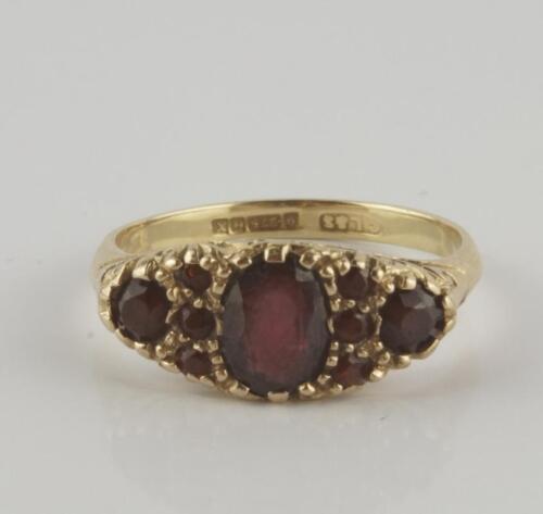 A Victorian 9ct gold and nine stone ruby ring