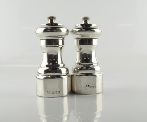 A pair of silver salt and pepper mills