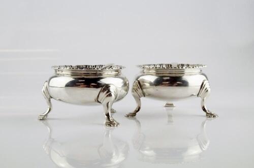 A pair of George IV silver cauldron salts