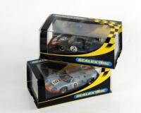 Two Scalextric Ford GT40 slot cars.