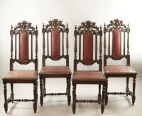 A set of four Jacobean revival hall chairs