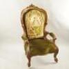 A Victorian walnut spoon back open armchair