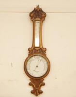 An Edwardian oak aneroid banjo barometer