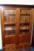 An antique and later mahogany glazed bookcase