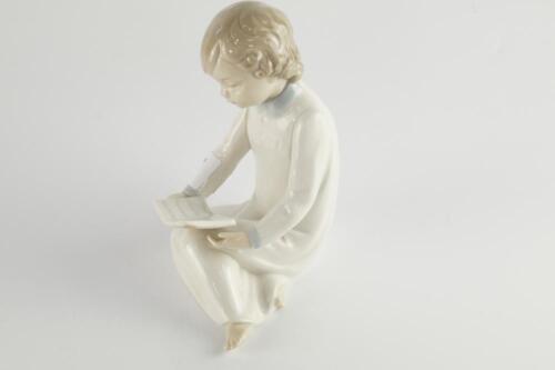 A Nao figure of a child reading