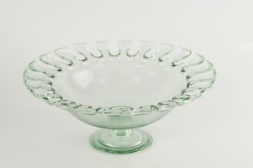 A glass bowl with sunburst style rim