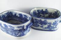 Two blue and white ceramic foot baths