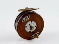 A 20thC mahogany and alloy Nottingham style centrepin reel