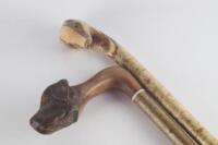 Two carved walking sticks