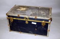 A metal framed travel trunk