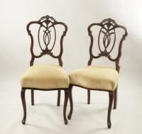 A pair of Victorian mahogany shield back bedroom chairs