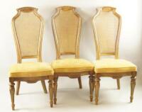 A set of six Bergere back early 20thC walnut dining chairs