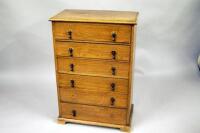 An early 20thC oak six drawer chest of drawers