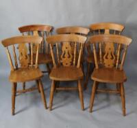 A set of six pine kitchen chairs