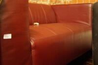 An oxblood leather two seater sofa