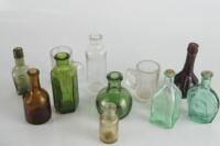 A selection of Georgian and later small glass bottles