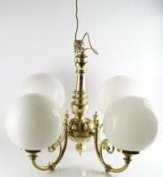 A brass effect four branch light fitting