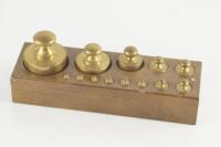 A brass metric weight set