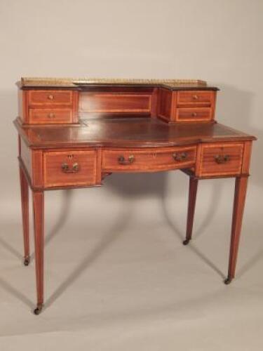 An Edwardian mahogany and satinwood cross banded writing table