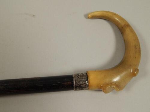 An Edwardian ebonised and rhinoceros horn walking stick