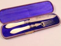 A Victorian silver cake knife and fork