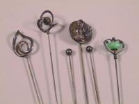 A collection of silver mounted hat pins