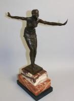 A bronze figure of a dancing lady