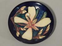 A Moorcroft Collectors Club coaster