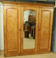 A Victorian satin walnut triple wardrobe