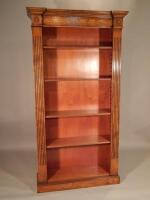 A reproduction burr elm and marquetry inverted breakfront open bookcase