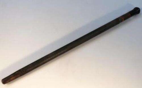 A mid-20thC ebonised carved and part metal swagger stick