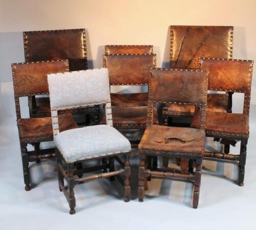 A set of oak framed leather dining chairs