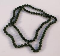 A string of polished jadeite beads