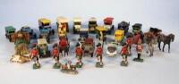 A quantity of Britain's lead soldiers and various die-cast vehicles