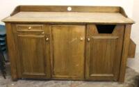 A 20thC triple oak cabinet