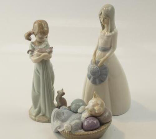 A Lladro figure of small girl with kittens