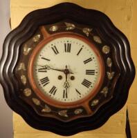 A Continental ebonised mother of pearl inlaid wall clock