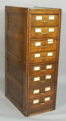 An Edwardian oak and brass mounted filing cabinet