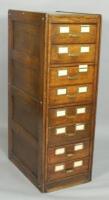 An Edwardian oak and brass mounted filing cabinet