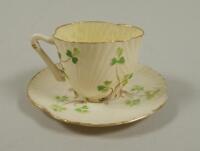 A Belleek porcelain cup and saucer