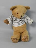 A straw stuffed mid 20thC Teddy bear (AF)