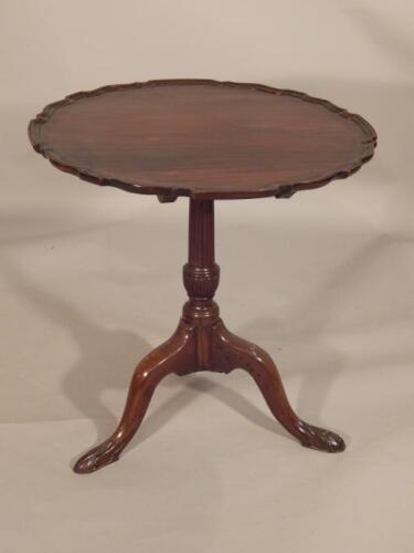 A mahogany tripod table