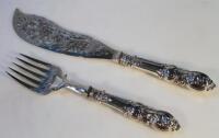 A pair of Victorian silver fish servers