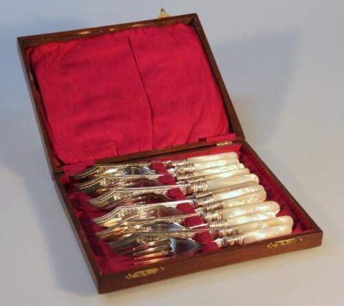 A matched set of Edwardian silver mother of pearl and plated fish eaters