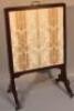 An Edwardian mahogany articulated fire screen